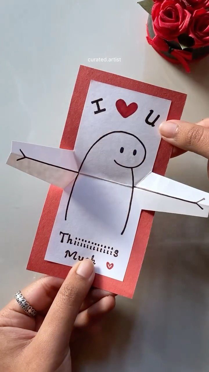 32 Anniversary Card Ideas to Make at Home (Photos Inside) 28 Handmade anniversary card with a character and fold-out arms saying I love you this much