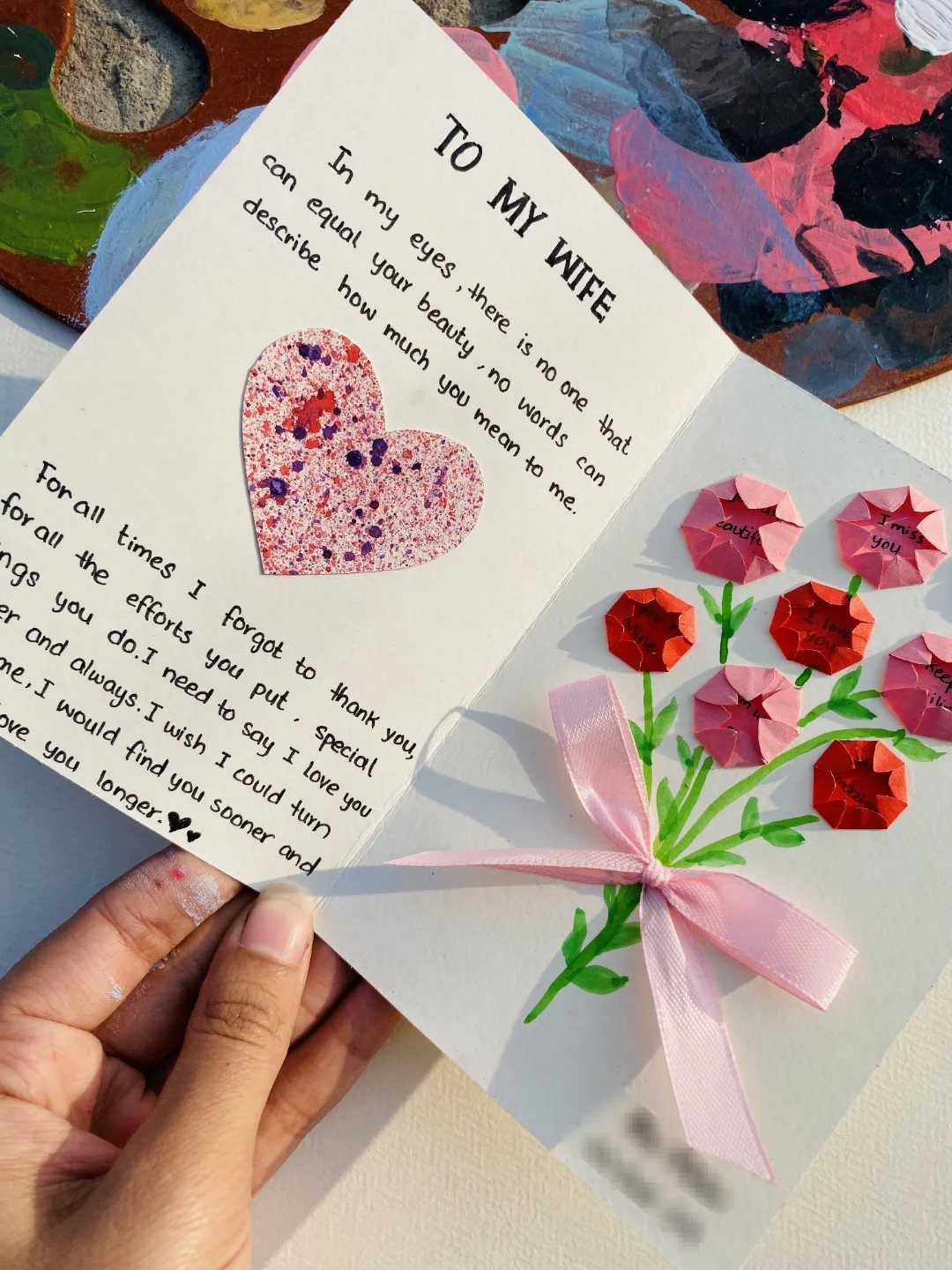 32 Anniversary Card Ideas to Make at Home (Photos Inside) 31 Handmade anniversary card for a wife with origami flowers and a glittery heart.