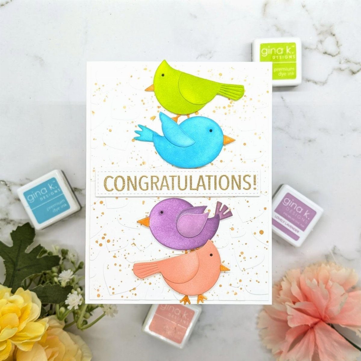 32 Anniversary Card Ideas to Make at Home (Photos Inside) 30 Greeting card with colorful paper birds and gold congratulations text on marble background