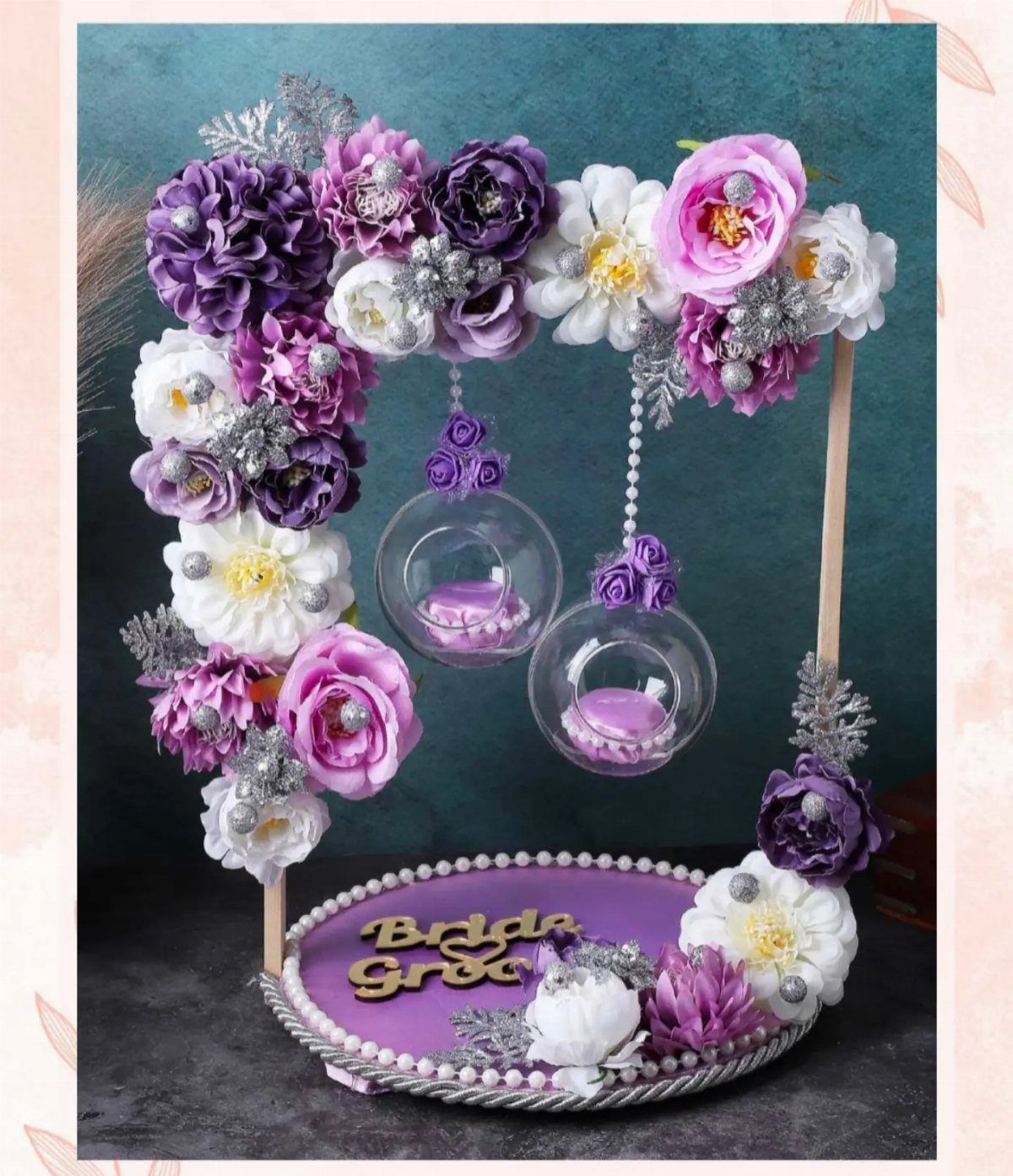 Purple and white floral platter with Bride and Groom names and hanging glass globes.