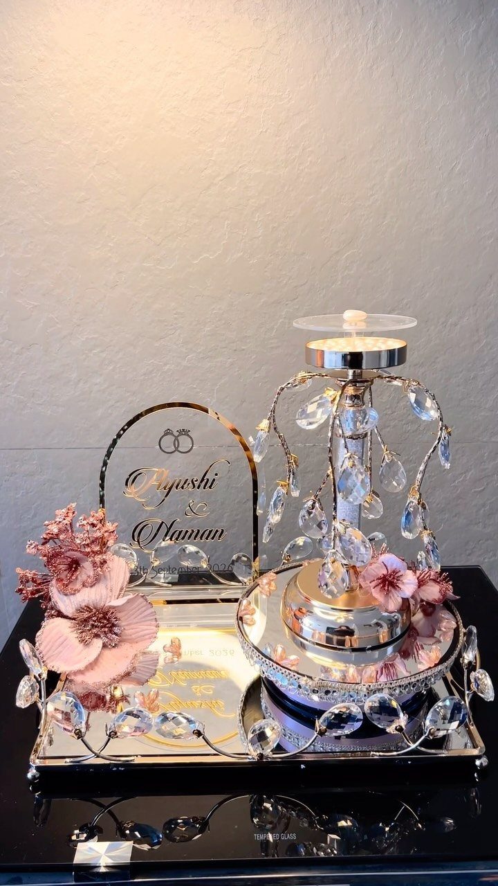Silver metallic engagement tray with crystal accents, pink flowers, and a name plaque.