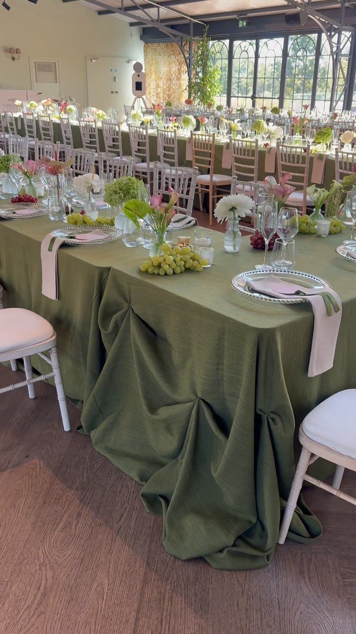 Green Bridal Shower Ideas: 10 Eco-Friendly Party Picks 3 Olive green cloth tablecloth on a dining table with white ceramic plates and glassware.