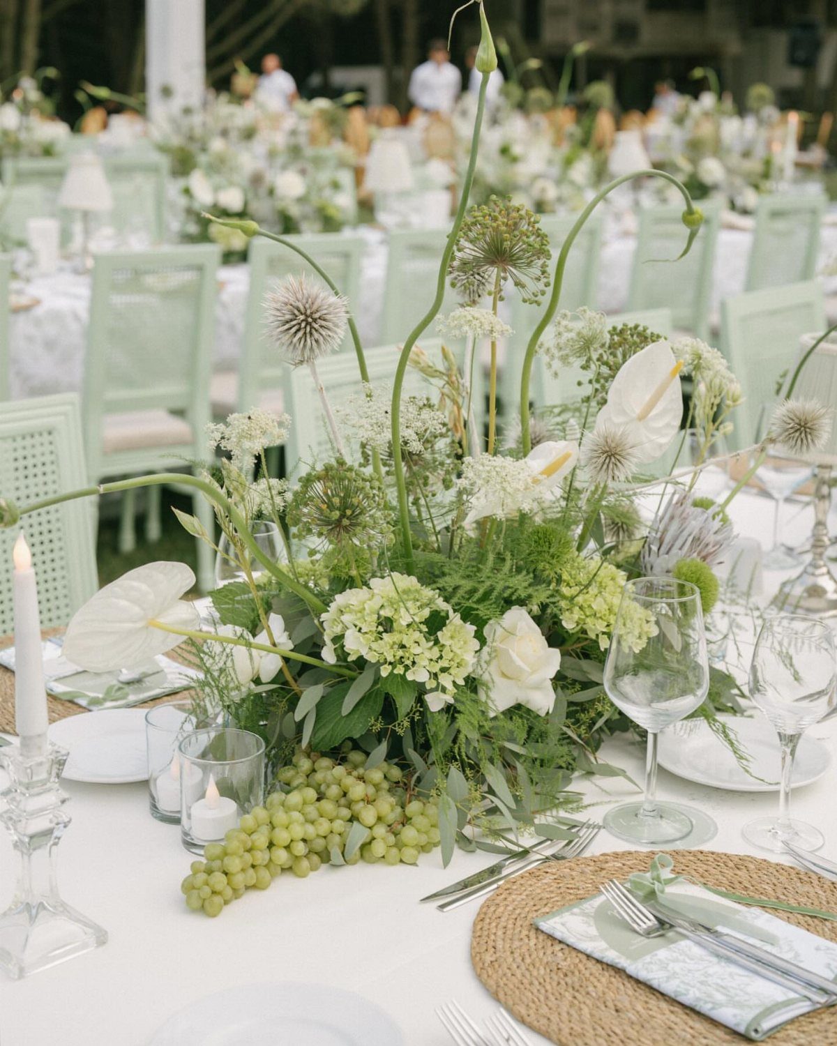 Green Bridal Shower Ideas: 10 Eco-Friendly Party Picks 6 Floral centerpiece with white flowers and green grapes on a white dining table