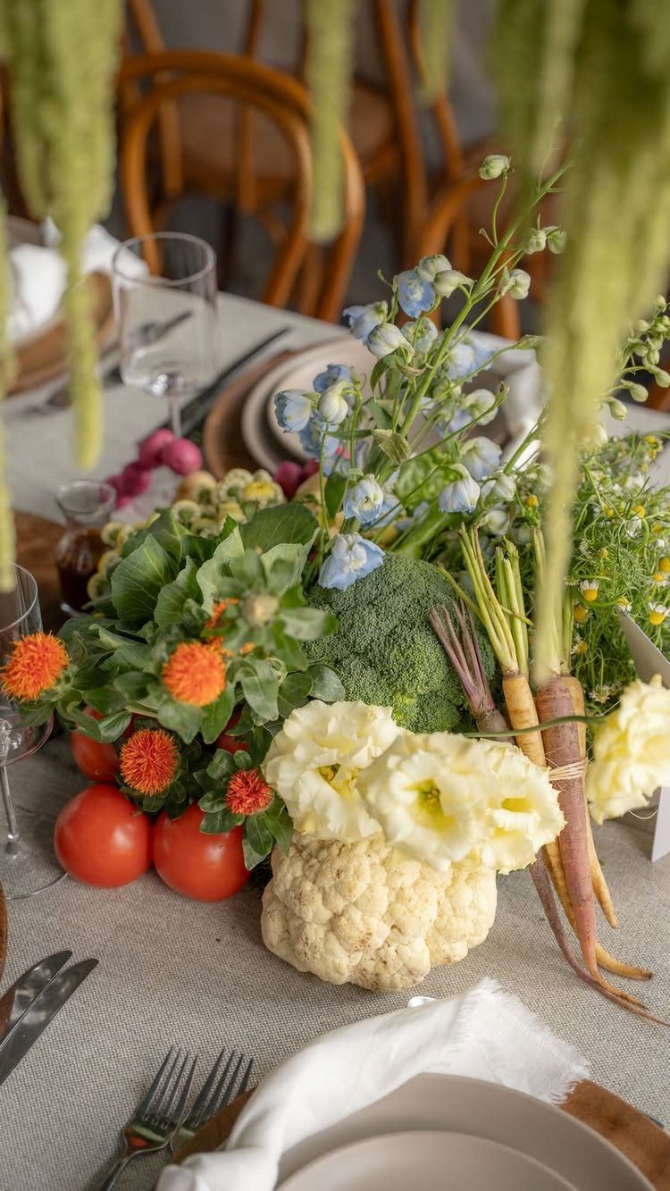 Green Bridal Shower Ideas: 10 Eco-Friendly Party Picks 4 Cauliflower, broccoli, carrots, and tomatoes mixed with flowers as a table centerpiece.