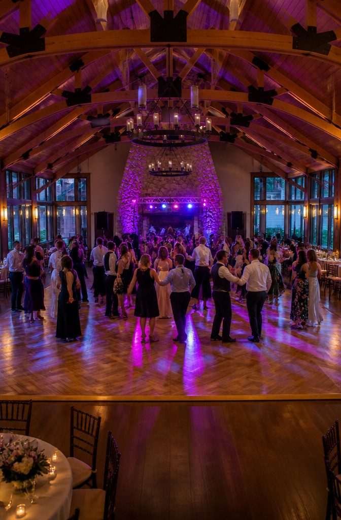 Wedding guests dancing on the floor during the reception.