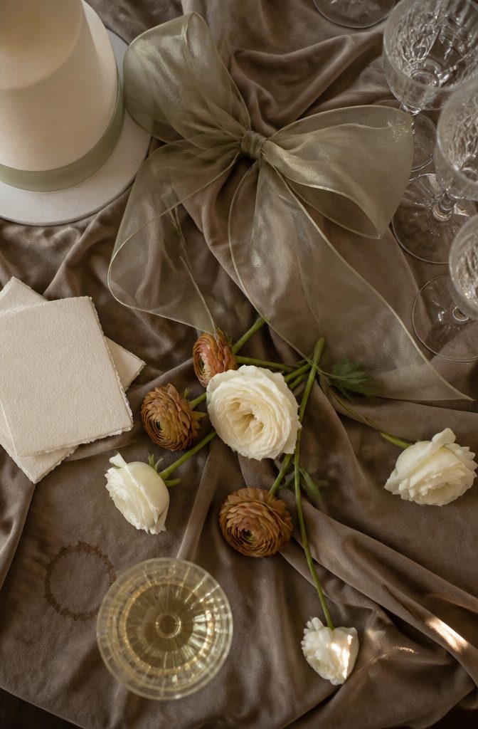 Sage Green and Brown Wedding: 8 Ways to Style the Palette 7 Champagne station with a large organza bow and floor-length draped linen
