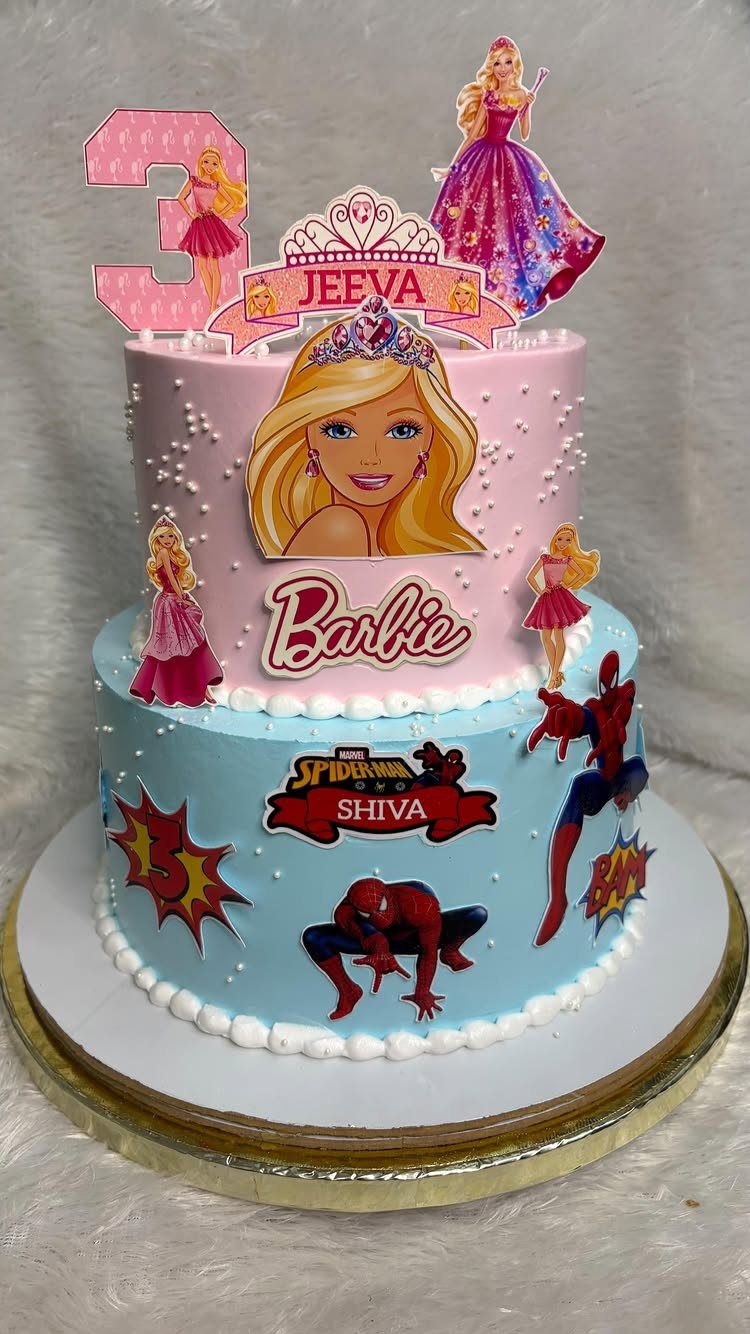 Two-tiered birthday cake with pink Barbie theme on top and blue Spider-Man theme below.