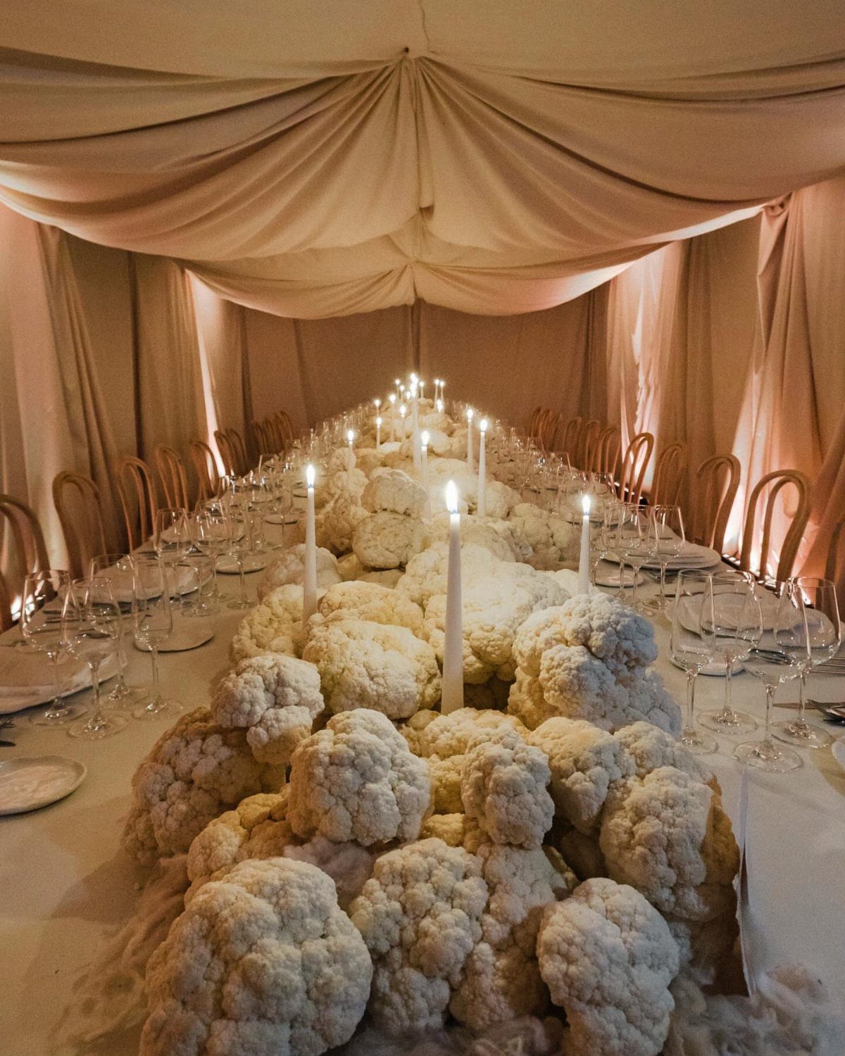 Wedding Mood Board Ideas: 39 Styles from Celestial to Coastal 21 Long wedding table with a centerpiece made of white cauliflower and taper candles