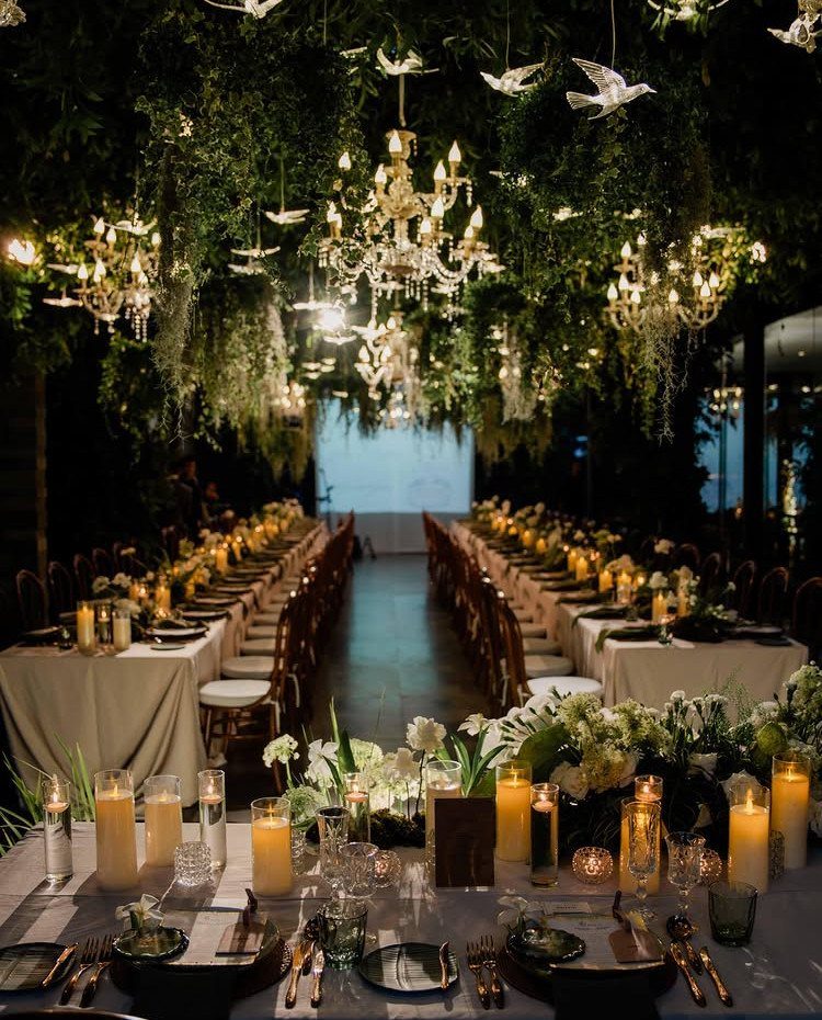 Wedding Mood Board Ideas: 39 Styles from Celestial to Coastal 36 Elegant wedding reception with long tables, candles, and greenery with crystal chandeliers.