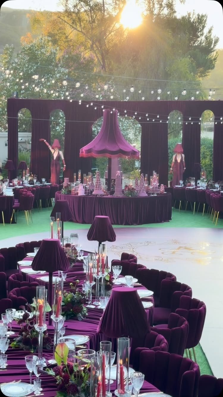 Wedding Mood Board Ideas: 39 Styles from Celestial to Coastal 30 Deep purple velvet tables and chairs at an outdoor event with string lights.