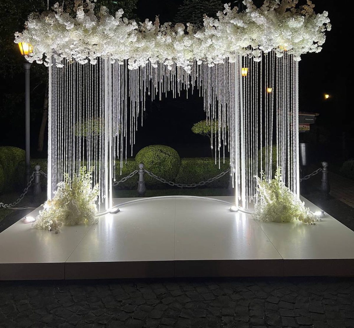 Wedding Mood Board Ideas: 39 Styles from Celestial to Coastal 19 White floral canopy with shimmering crystal curtains over a white outdoor dance floor